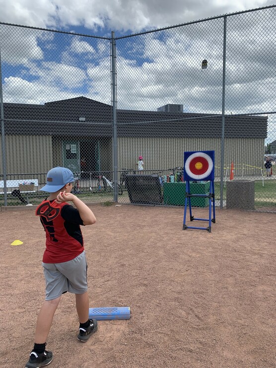 Student with foam axe throw game