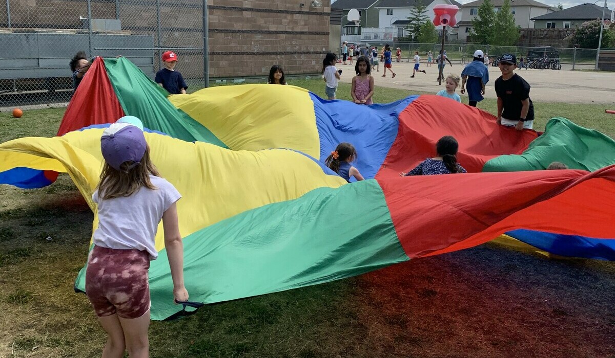 Children playing with parachute